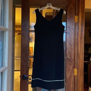 Black double v-neckline dress with rhinestones near bottom. Size 8